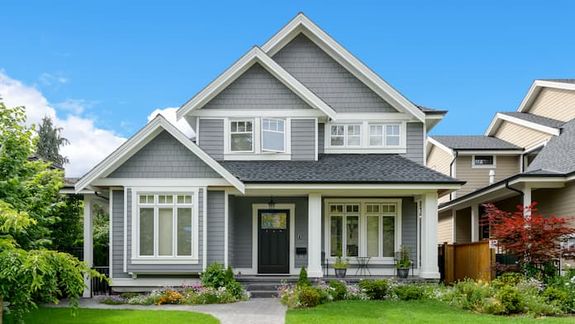 Two-story gray house with Hardie Board Siding