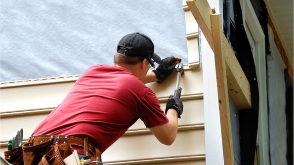 Installing siding on a house exterior