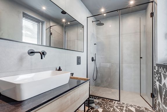 Modern bathroom with walk-in glass shower