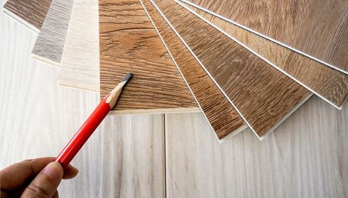 Luxury vinyl flooring samples with pencil