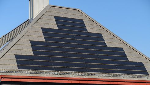 Solar shingle roof replacement option on a house