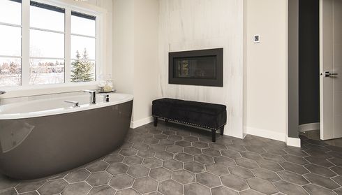Bathroom with dark hexagon tile flooring