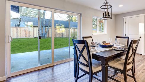 Dining room with sliding patio doors to backyard